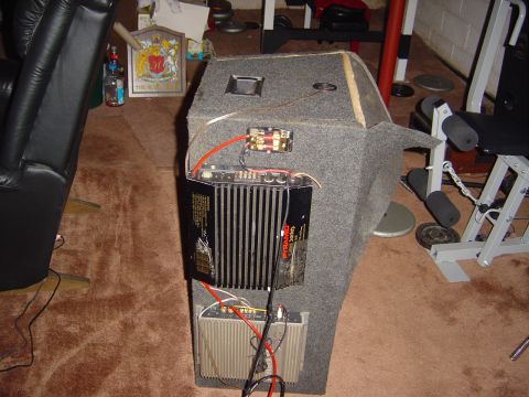 1986 Ford Bronco - Car audio equipment, including amplifiers and wiring, is mounted on a carpeted enclosure.