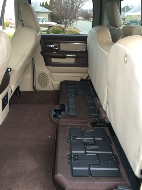 2015 Dodge 1500 - Interior view of a truck's rear cabin, highlighting the seating and floor storage compartments.