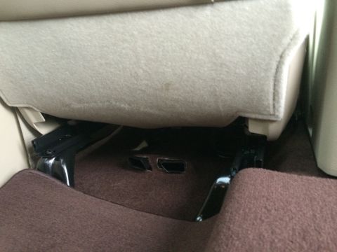 2015 Dodge 1500 - Interior view showing the underside of a vehicle seat, seat rails, and carpeting.