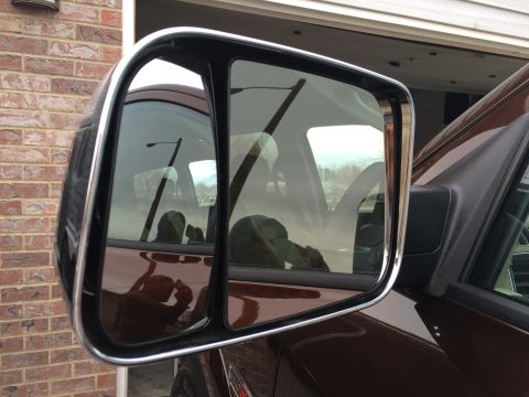2015 Dodge 1500 - Reflection in the side mirror of a 2015 Dodge 1500, showing the interior and driver.