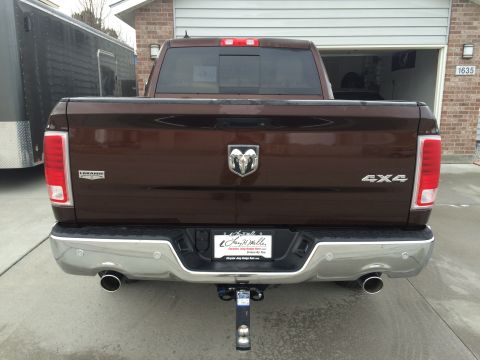 2015 Dodge 1500 - Rear view of a brown 2015 Dodge 1500 Laramie pickup truck parked in a driveway.