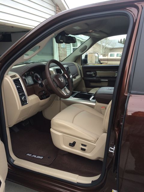 2015 Dodge 1500 - Interior view of a brown pickup truck, showing tan leather seats and dashboard details.