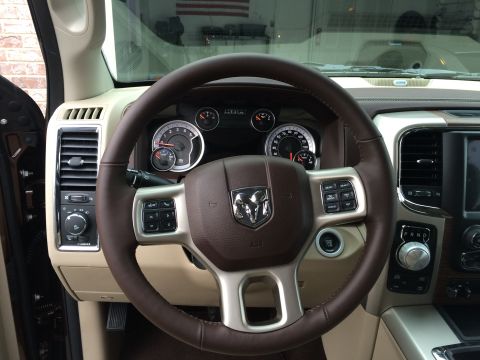 2015 Dodge 1500 - Dashboard and steering wheel of a 2015 Dodge 1500 truck.