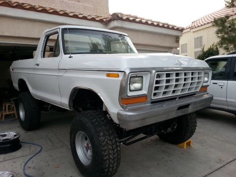 1979 Ford Bronco - This lifted 1979 Ford Bronco features a distinctive grille and prominent off-road tires.