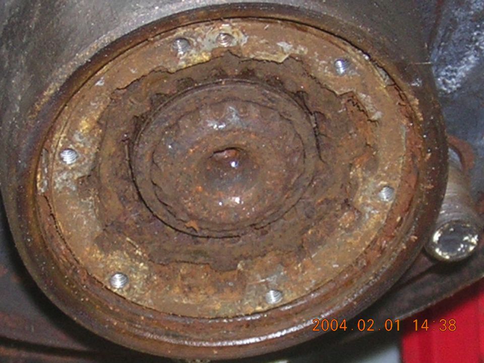 Rusted hub assembly with visible bolts and internal splines