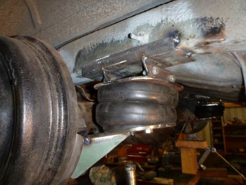 1964 Mercury Monterey - Custom air suspension bellows are visible, mounted to the vehicle's undercarriage near the rear axle.
