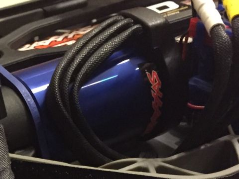 2014 Dodge 1500 - Close-up of a blue motor with red 'Traxxas' logo and black wiring harness.