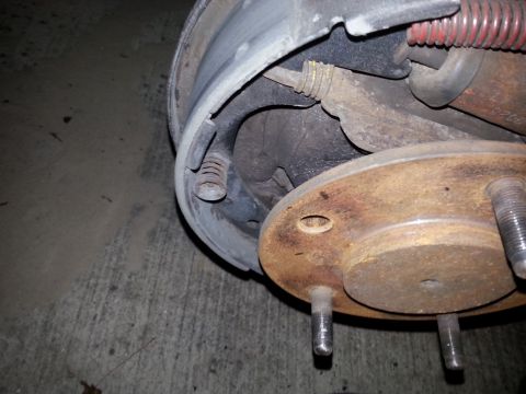 1992 Ford Bronco - Close-up view of a vehicle's brake drum and hub assembly, highlighting internal brake components.