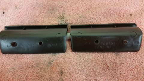 2015 Chevrolet new - Two black plastic automotive parts are shown, each with stamped part numbers and markings.