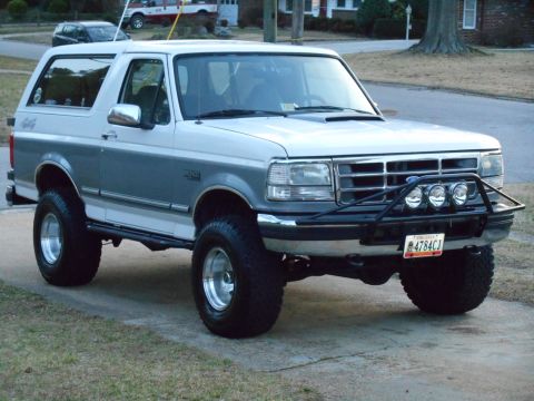 1994 Ford Bronco - This 1994 Ford Bronco features a two-tone paint scheme and a custom front bumper with auxiliary lights.