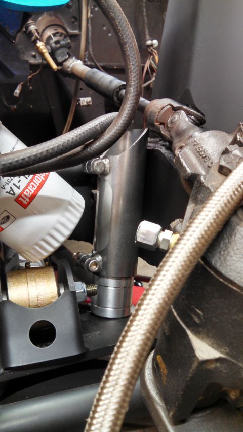 1967 Ford F-250 - Detail shot of various engine bay components, including an oil filter and hydraulic lines.