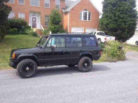1987 Toyota 4Runner - Black 1987 Toyota 4Runner parked on asphalt in front of a suburban brick house.
