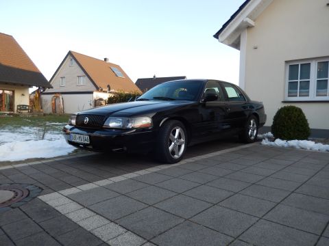 2003 Mercury Marauder - This black 2003 Mercury Marauder is parked in a driveway with houses in the background.