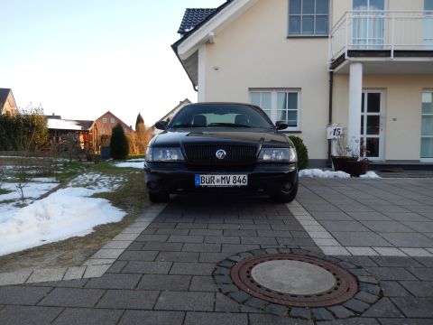 2003 Mercury Marauder - Front view of a black 2003 Mercury Marauder parked in a paved driveway.