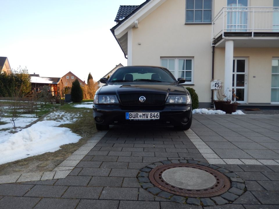 Black 2003 Mercury Marauder front view parked in driveway with house in background