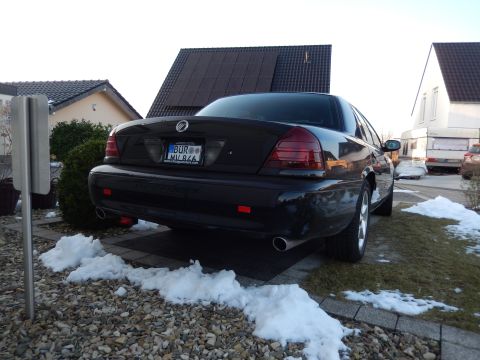 2003 Mercury Marauder - This black 2003 Mercury Marauder is seen from the rear, parked in a driveway with snow on the ground.