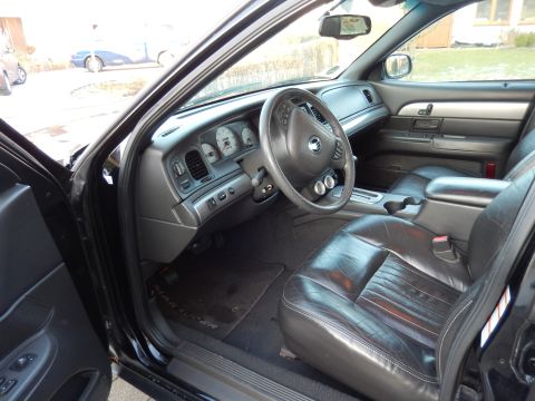 2003 Mercury Marauder - The interior of a 2003 Mercury Marauder features leather seats and a clear view of the dashboard instrumentation.