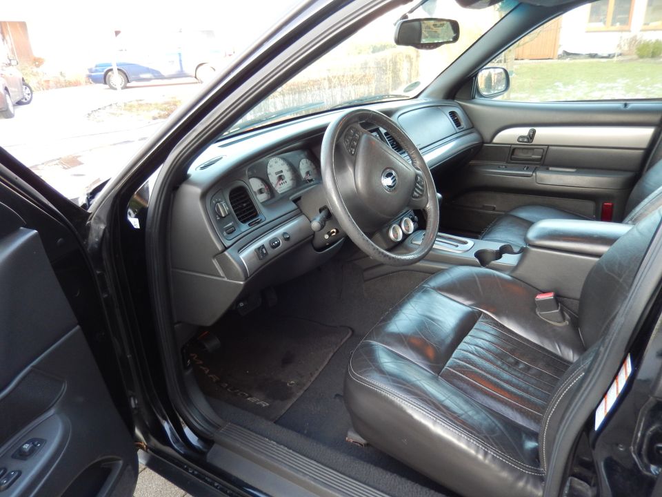 Interior shot of a 2003 Mercury Marauder showing leather seats, dashboard, and steering wheel