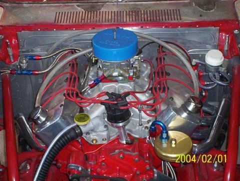 1963 Ford Falcon - Close-up view of a modified V8 engine bay, showing custom components and wiring.