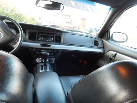 2003 Mercury Marauder - The interior of a 2003 Mercury Marauder is captured, highlighting the dashboard and seating area.