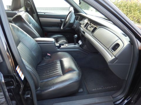 2003 Mercury Marauder - Interior view of a 2003 Mercury Marauder, highlighting its black leather seats and dashboard details.
