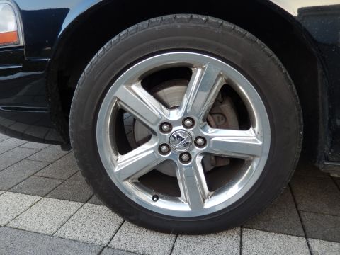 2003 Mercury Marauder - A close-up view of a vehicle's wheel and tire, showing the brake caliper and rim detail.