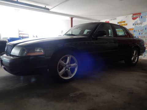 2003 Mercury Marauder - This black 2003 Mercury Marauder is captured in a 3/4 front view, its distinctive body style.