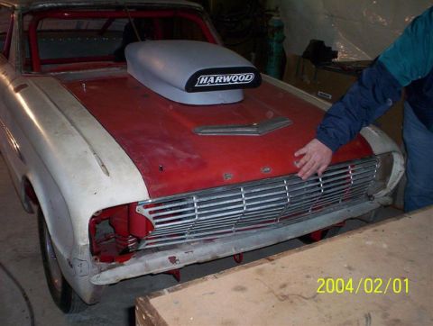 1963 Ford Falcon - Front view of a 1963 Ford Falcon project car with a large hood scoop.