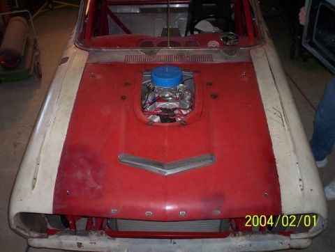 1963 Ford Falcon - This 1963 Ford Falcon appears to be undergoing modifications for racing, with its engine exposed and a roll cage visible.