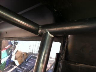 1995 Ford Bronco - Interior view of custom roll cage tubing construction.
