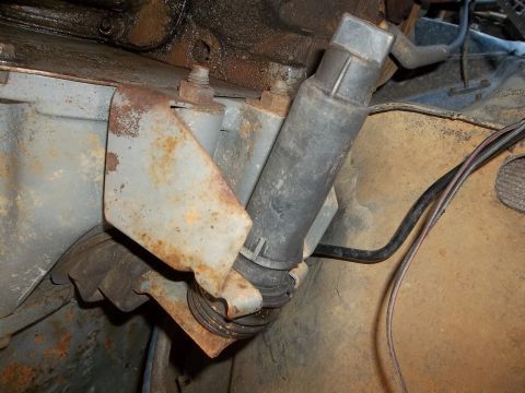 1995 Ford Bronco - Close-up view of an engine component with visible rust and wiring.