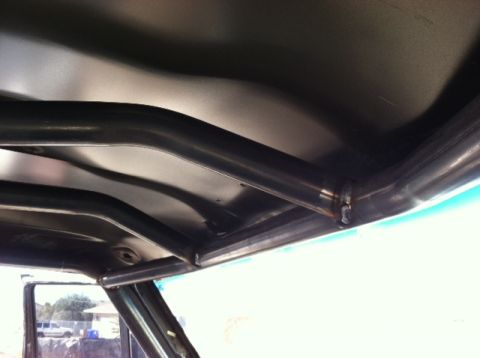1995 Ford Bronco - Custom roll cage installed inside a vehicle's interior.