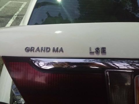 2000 Mercury Grand Marquis - Rear view of a 2000 Mercury Grand Marquis LSE, showing the 'GRAND MA' and 'LSE' badging.