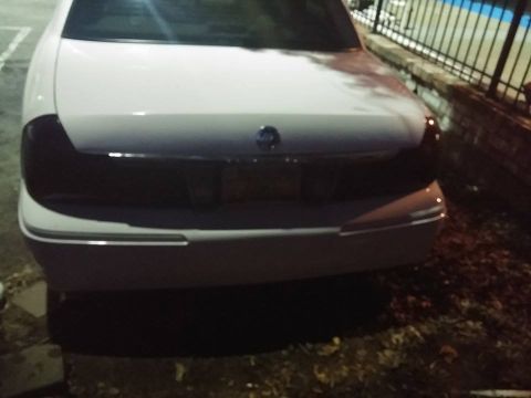 2000 Mercury Grand Marquis - Rear view of a white 2000 Mercury Grand Marquis with tinted taillights.