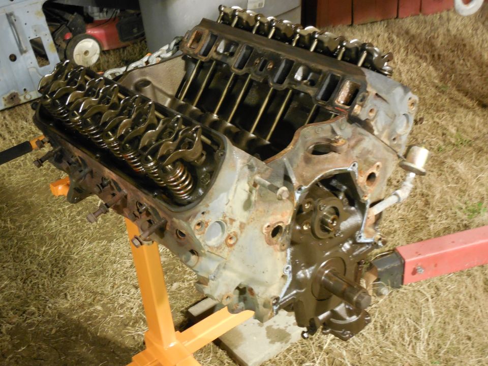 Thankfully, there was no sign of sludge having flaked off the original intake.  The timing chain was still VERY tight, but I'm not putting it back.  The pan gasket was cork, but the valve covers were steel-reinforced nitrile.

Since the long block seems to be OK (it's a Jasper reman installed probably less than 5Kmi ago), this is as far as I'm going - now, I'll put it back together and paint it.

I'll probably swap out the oil sender plumbing for a factory part.