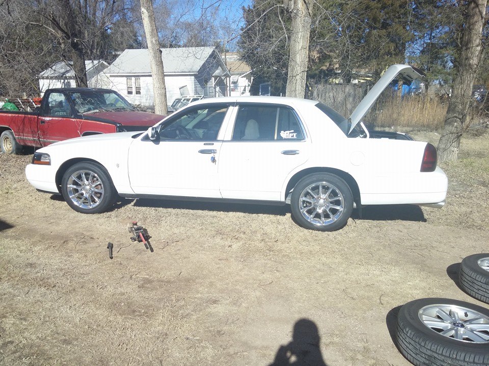 White 2000 Mercury Grand Marquis, rear view with trunk open