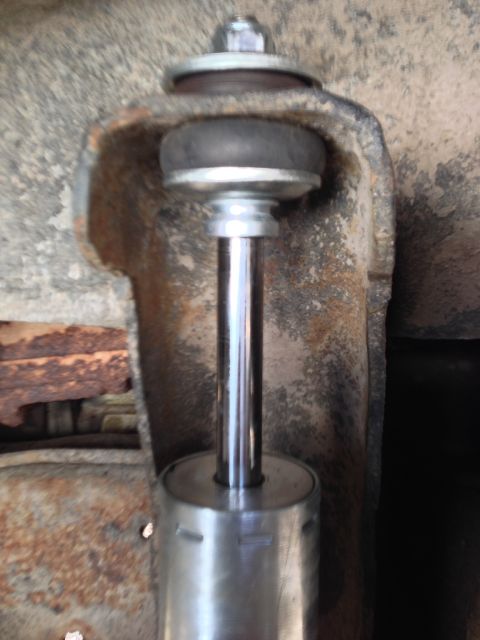 1979 Ford Bronco - Shock absorber mounting bracket detail, showing the upper attachment point and bushing.
