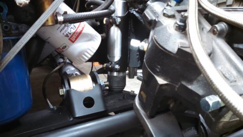 1967 Ford F-250 - A close-up view of various engine components, including an oil filter and hydraulic lines.