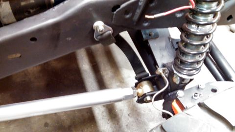 1967 Ford F-250 - Detail of a vehicle's undercarriage, showing suspension components and frame.