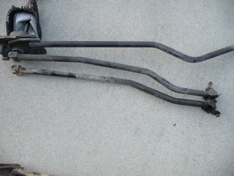 1993 Mazda MX-3 - Shift linkage components laid out on concrete, possibly for a manual transmission vehicle.