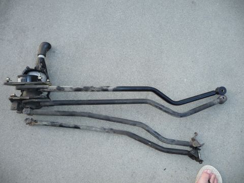 1993 Mazda MX-3 - This is a car's shifter linkage assembly, showing the various rods and levers involved in gear selection.