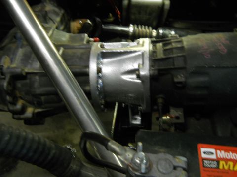 1992 Ford Bronco - This image shows a close-up view of a vehicle's transmission and exhaust components, with some text visible on a sticker.