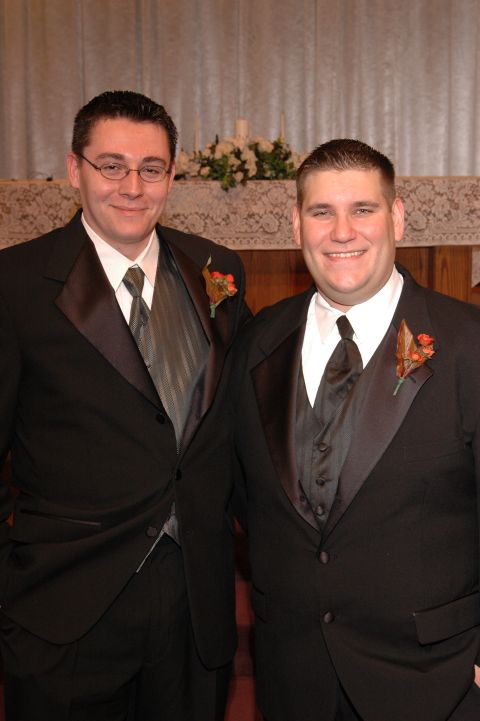 1985 Ford Crown Victoria LTD - Two men in formal wear pose for a photograph, likely at a wedding or formal event.