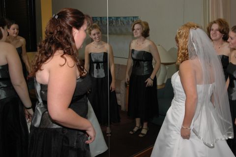 1985 Ford Crown Victoria LTD - A bride and her bridesmaids prepare for the wedding ceremony, with some reflected in a mirror.