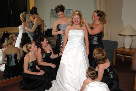 1985 Ford Crown Victoria LTD - Wedding party members assist the bride with her dress before the ceremony.