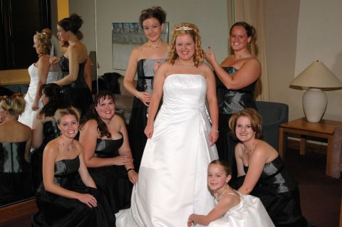1985 Ford Crown Victoria LTD - A bride and her wedding party pose for a photo before the ceremony.