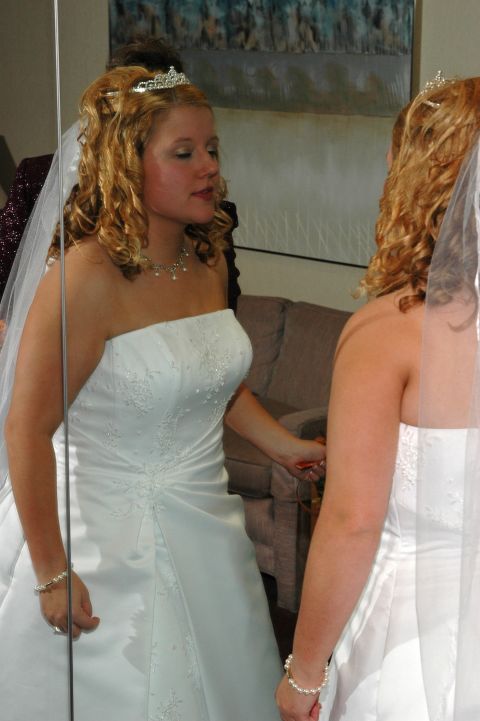 1985 Ford Crown Victoria LTD - Bride checks her appearance in the mirror before her wedding ceremony.
