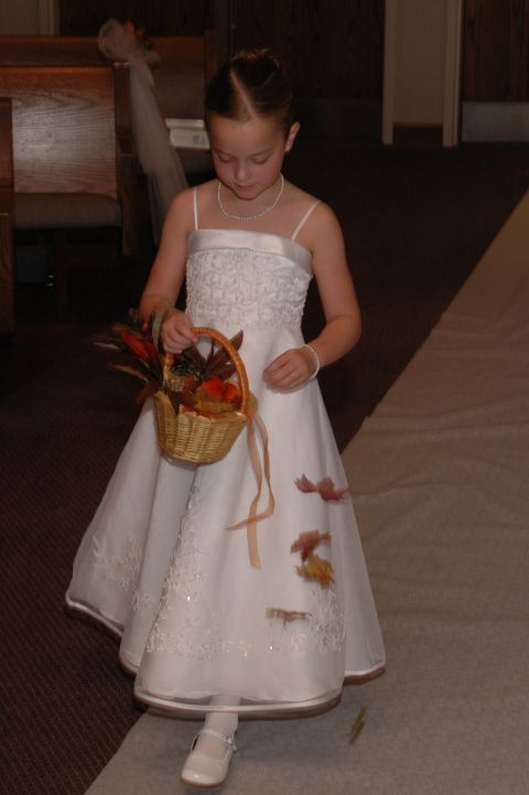 1985 Ford Crown Victoria LTD - Flower girl walks down the aisle holding a basket with decorative leaves.