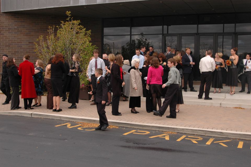 People gathered outside a building entrance