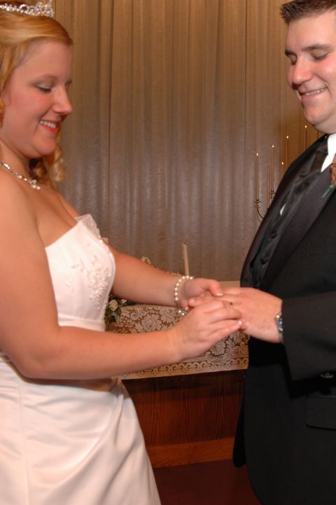 1985 Ford Crown Victoria LTD - A couple exchanges wedding rings during their ceremony.